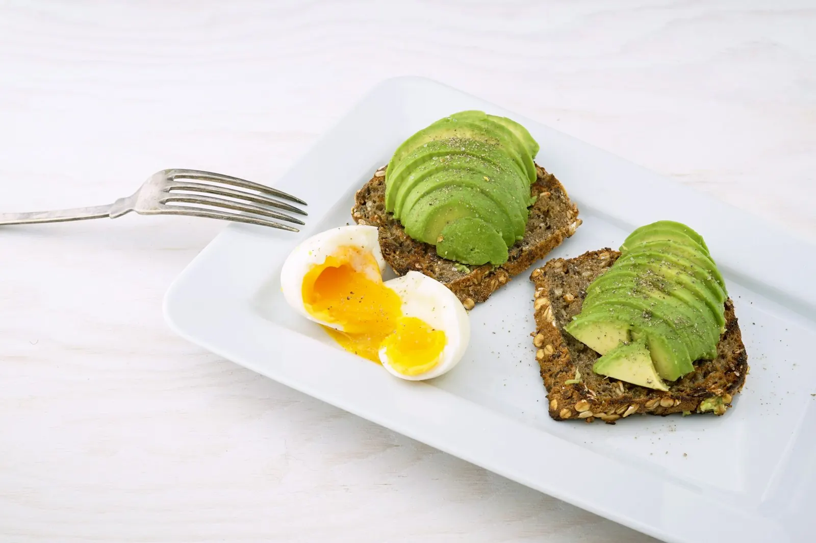 Smashed avocado toast with poached egg